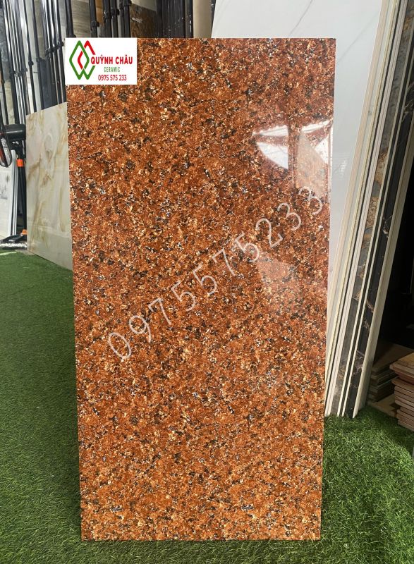 Gạch ốp tường 40x80 bóng kính đá nâu đỏ hoa cương