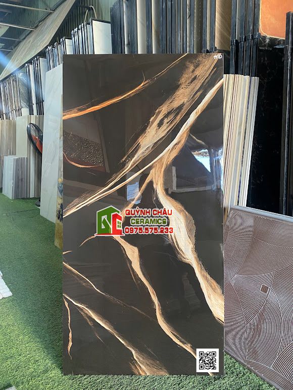 Gạch 60x120 đen vân đá vàng cam sang trọng