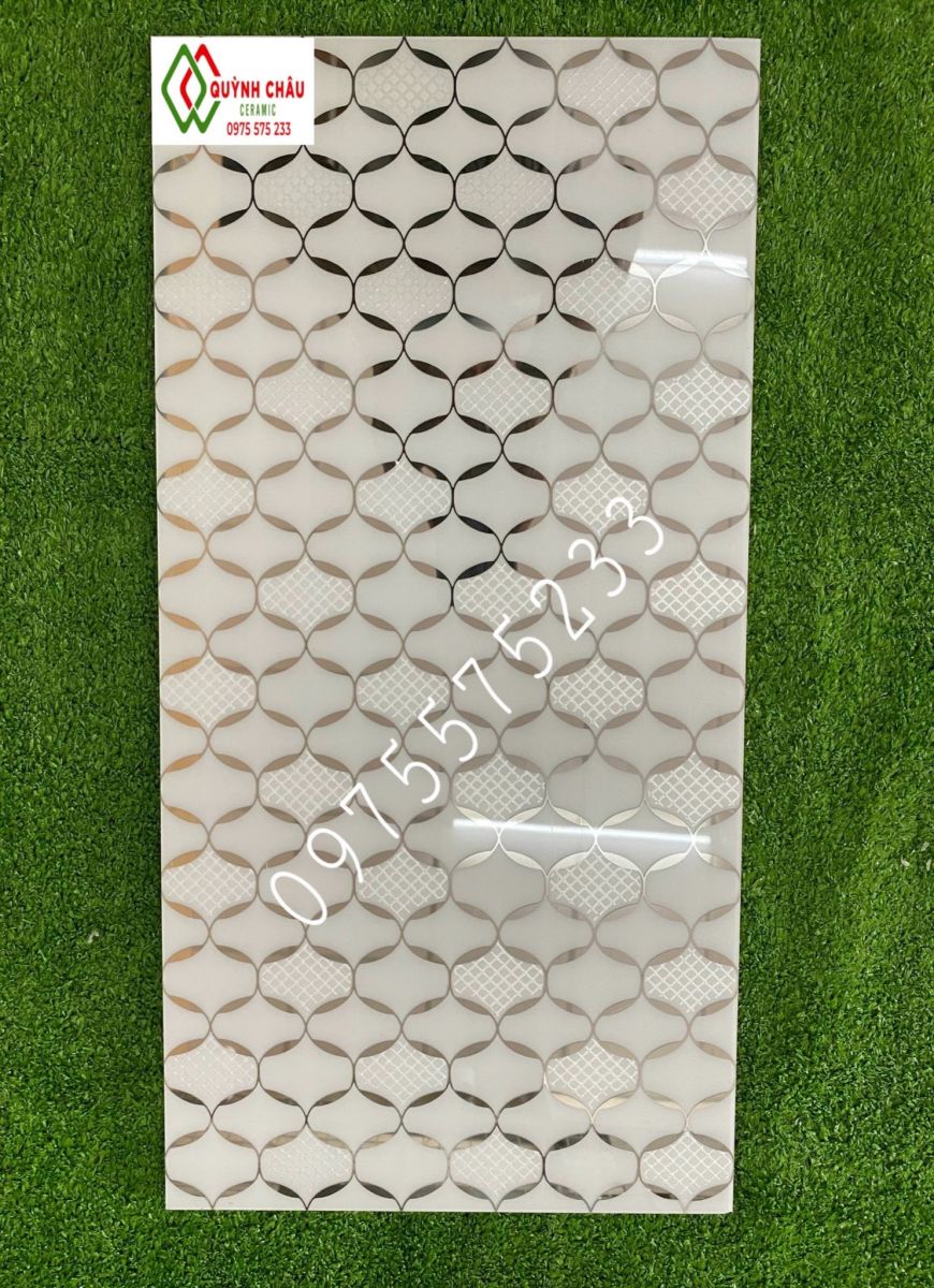 Đá bóng kính 30x60 nhũ vàng ốp lát