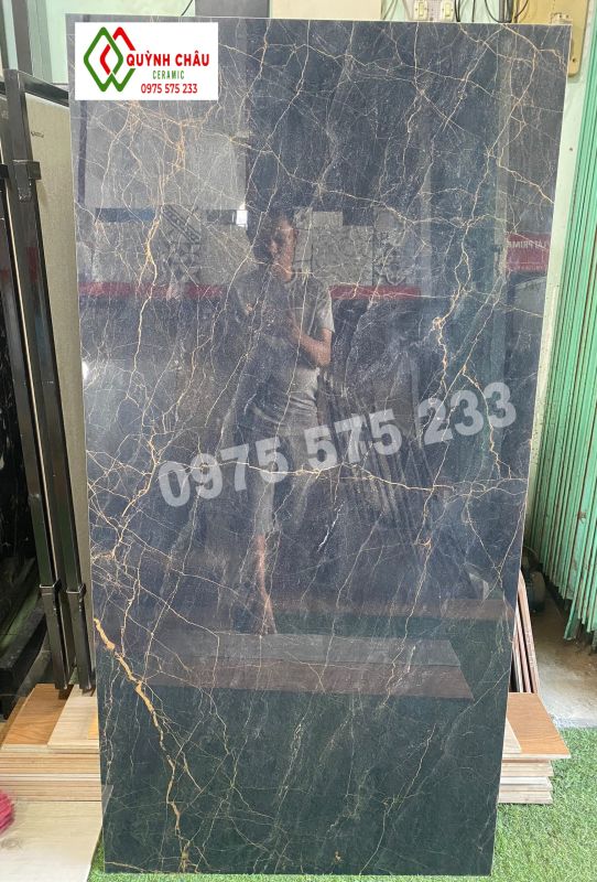 Gạch ốp lát tây ban nha 750x1500 đen vân vàng cam siêu bóng cao cấp Gạch ốp lát tây ban nha 750x1500 đen vân vàng cam siêu bóng cao cấp